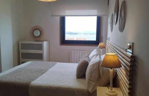 Un rincón con vistas a la Ría, playa y parking. - Foto 18