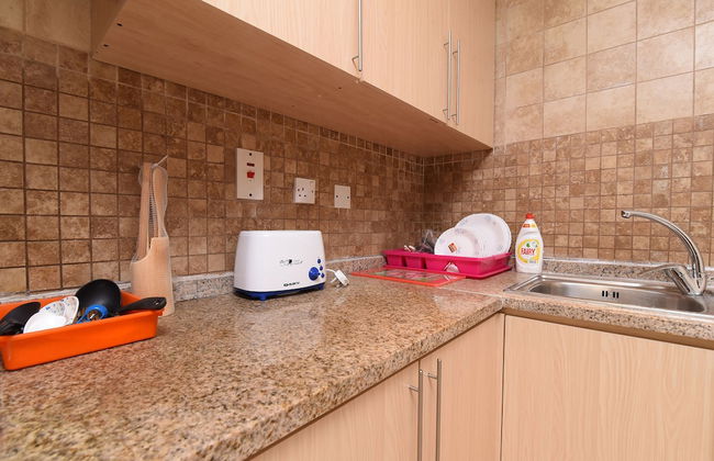 OYO Home 2351BHK Capitol Tower DIC - Photo 9