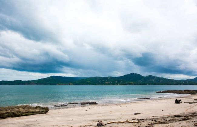 Beachfront Condo with Warm, Rustic Interiors & Direct Access to Playa Flamingo - Photo 17