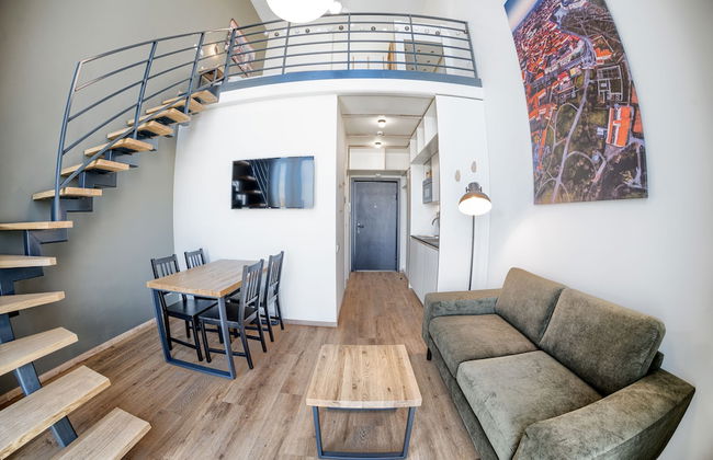 TopFloor Apartments - Photo 1