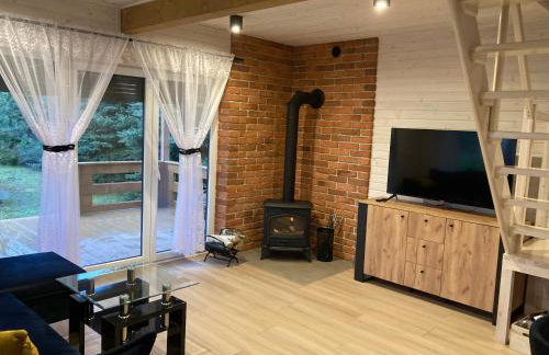 Domek drewniany nad stawem - Foto 10