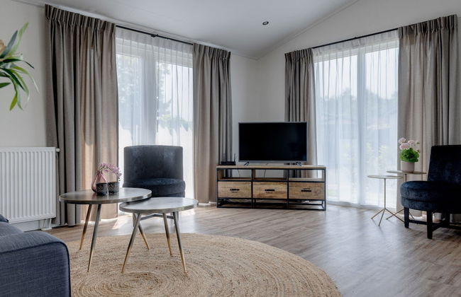 Chalet by Pond in Eindhoven Holiday Park - Photo 1