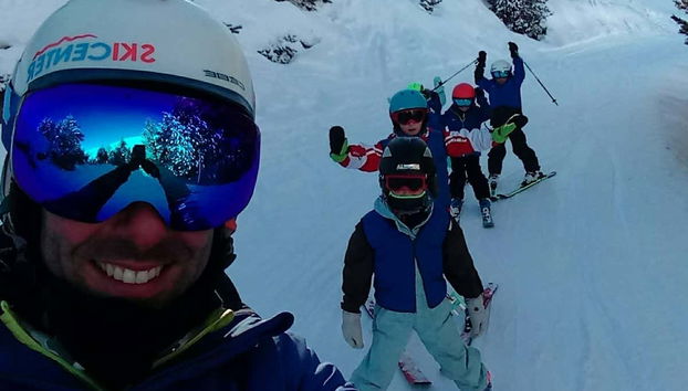 Skiiing behind the instructor