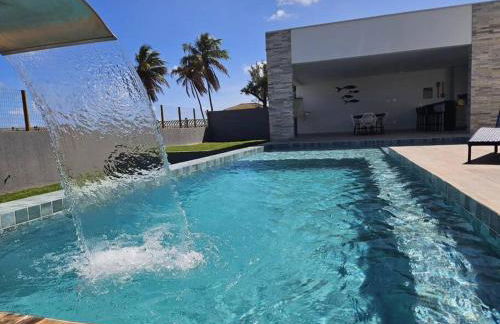 Piscina aquecida, 5 suítes e pé na areia com vista espetacular!! - Photo 8