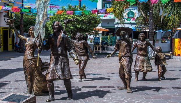 Admire the statues in the square