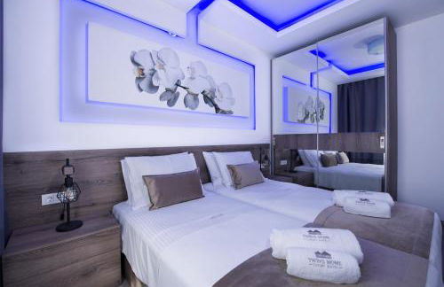 TWIN'S HOME LUXURY SUITES - Photo 5