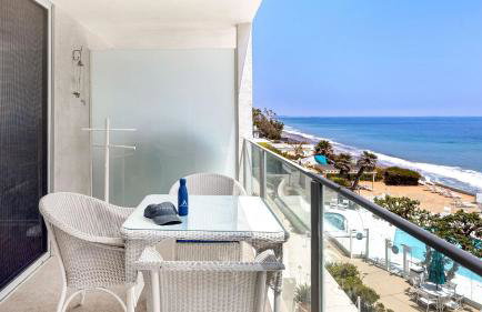Oceanfront Gem w Balcony Pool Hot Tub Carbon Beach Access Bluewater Haven by AvantStay - Photo 1