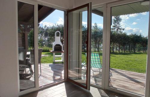 Dom z pięknymi widokami na jezioro ryńskie ilasy. - Foto 11