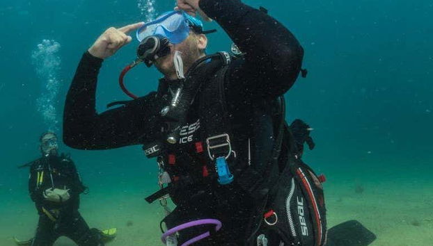 Learning to empty the diving mask