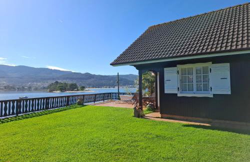 Casa de madera sobre el mar - Foto 3