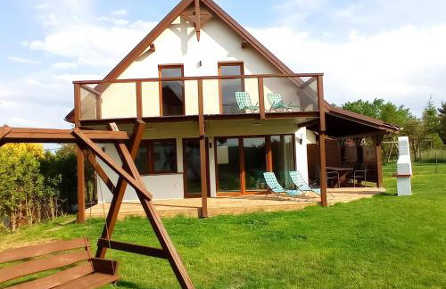 Dom z pięknymi widokami na jezioro ryńskie ilasy. - Foto 5