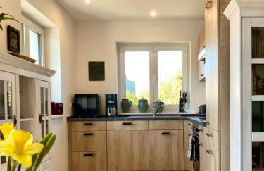 Gemütliche Wohnung mit Sonnenterrasse im blauen Holzhaus - Foto 9