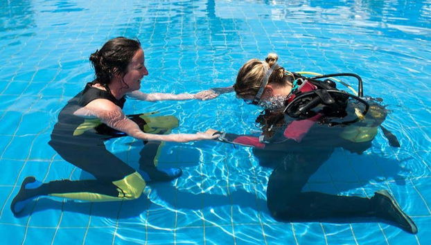 Practicing diving in confined water