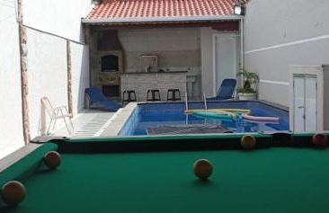 "Lindíssima Casa Pé na Areia com Opção da Piscina Aquecida Cobrado a Parte, Sala de Jantar, 3 Amplos Quartos, Sendo1Suíte, Amplo Espaço de Lazer com Área Gourmet em Deck Coberto com Churrasqueira e Mesa de Bilhar Frente a Piscina, Super Pertinho da Praia" - Photo 5