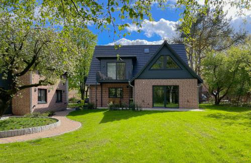 Traumhafte Ferienwohnung am Park, großer Balkon, voll ausgestattete Küche, Schreibtisch, WiFi, Smart TV, Carport, Wallbox, Fahrräder - Foto 8