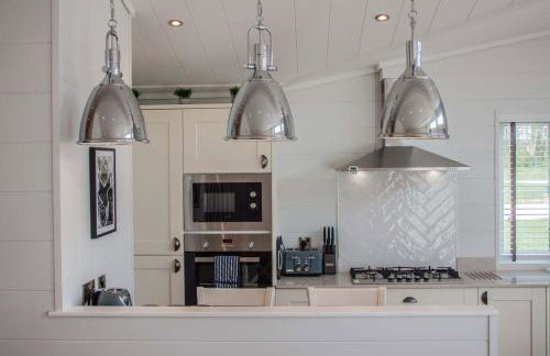 High Oaks Grange - Contemporary Lodges - Photo 25