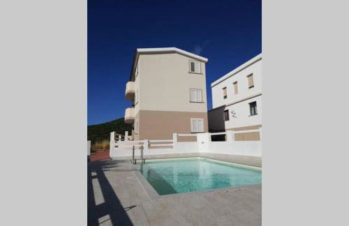 Trilocale vista mare con piscina a Badesi - Foto 1