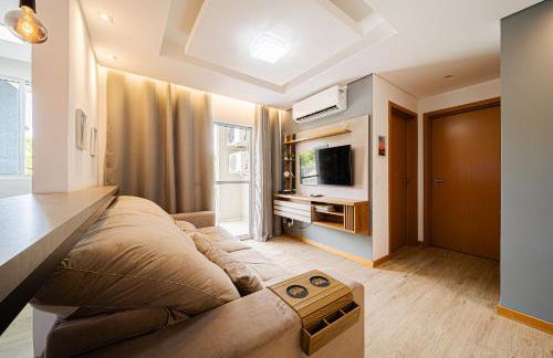 Aconchego e privacidade para sua família com 2 quartos, sala e cozinha integrados e sacada com churrasqueira - Foto 5