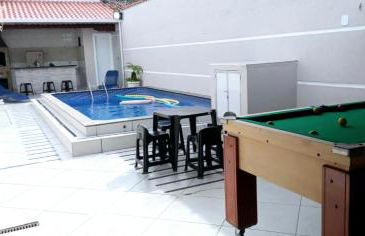 "Lindíssima Casa Pé na Areia com Opção da Piscina Aquecida Cobrado a Parte, Sala de Jantar, 3 Amplos Quartos, Sendo1Suíte, Amplo Espaço de Lazer com Área Gourmet em Deck Coberto com Churrasqueira e Mesa de Bilhar Frente a Piscina, Super Pertinho da Praia" - Photo 1