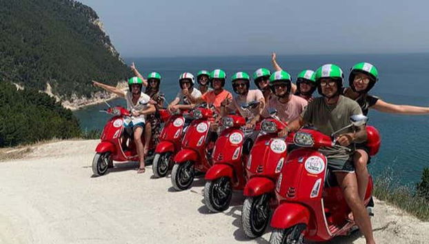 A group photo on the Vespas