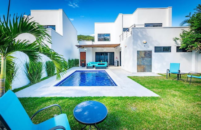 Ultramodern Townhome with an Inviting Coastal Design and Lush Outdoor Oasis with a Private Pool - Photo 29