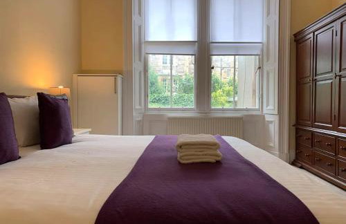 JOIVY Adorable 1 Bed Flat Near West End - Photo 17