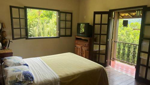 Refúgio Tranquilo na Natureza com Casa de Festas: Perfeito para Família e Amigos - Foto 2, Garden view