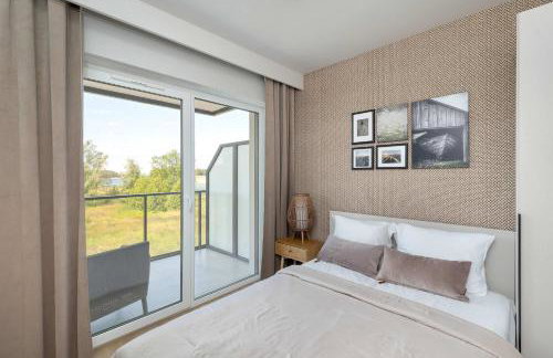 Bright Apartment Spadochroniarzy in Dziwnów with Parking & Pool by Noclegi Renters - Foto 19