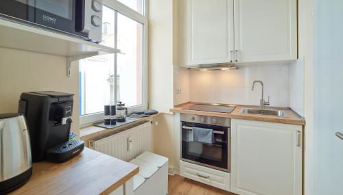 MARX - Studio-Apartment im Zentrum von Trier - Top-Lage, Gratis WLAN, ideal für Paare & Geschäftsreisende - Foto 4, stove, dishwasher, toaster