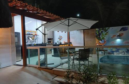 Linda casa com piscina, quiosque e churrasqueira a 150 metros da praia - Foto 12