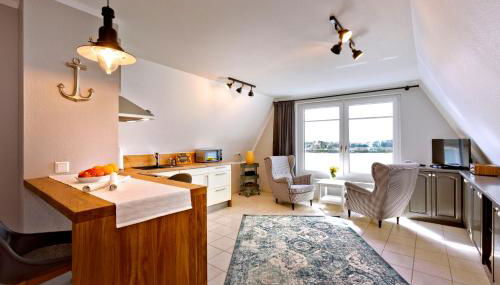 Fährmann im Häuschen am Rhein - Foto 4