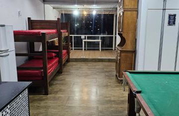 Belíssima Casa a Beira Mar com Piscina Aquecida Cobrado a Parte, 5 Quartos com Ar Condicionado, Amplo Salão de Jogos com Mesas de Bilhar e Pebolim, Amplo Espaço Externo com Churrasqueira em Deck Gourmet Coberto frente a Piscina,Tudo isso á Beira Mar - Photo 12