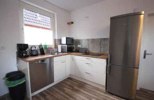 Moderne Ferienwohnung mit Terrasse & Garten Möwennest III - Photo 7