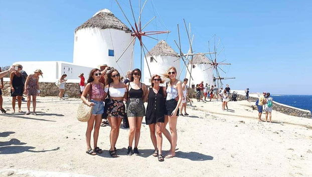 Posing next to the famous mills of Mykonos