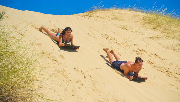 Alexandria Dunes Sandboarding Tour + Boat Ride - Photo 2, Enjoying the sandboarding activity