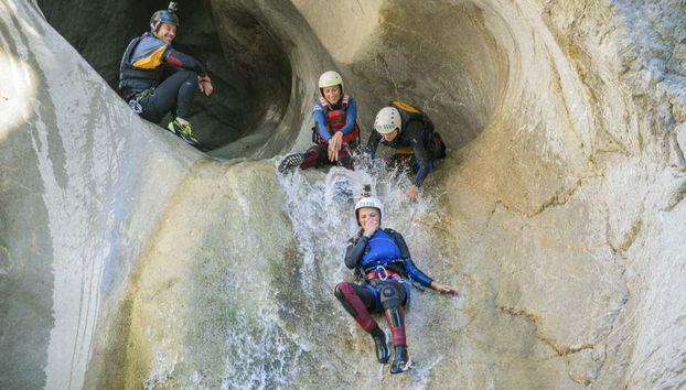 Descending a slide in Chli Schliere
