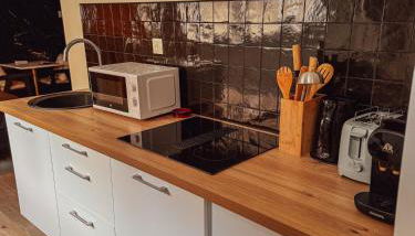 Jacuzzi privé, Sauna & Design Chic - Foto 5, stove