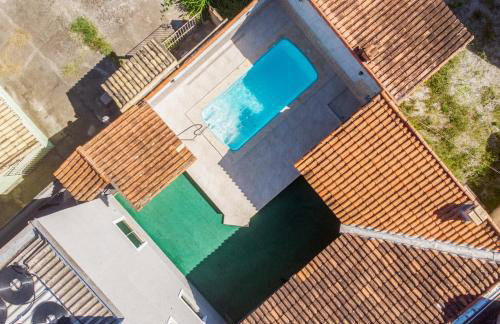 Refúgio Tropical Casa de Praia com Piscina e 4 Suítes e garagem 3 carros, 800 mtrs da praia internet 700 mbps, condomínio privado com pista de skate , quadra de futevôlei , campos e quadras de futebol! - Foto 48