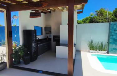 ESPAÇO PÉROLA GUANABARA, 70 Metros do Mar, 4 Suítes independentes COM AR, Área Gourmet Integrada com Piscina,Churrasqueira, 900 Metros de CASTELHANOS, ideal para FAMÍLIAS E AMIGOS - Foto 16