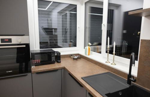 Neubau Apartment mit Kamin und Terrasse in Premium Lage Parkplatz inklusive - Foto 9