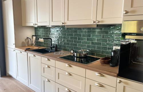 Amber Ferienhain - Ferienhaus 'Magnolie' mit verwunschenem Garten & privater Sauna - Foto 5