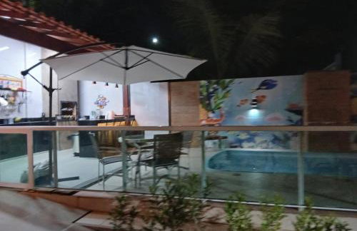 Linda casa com piscina, quiosque e churrasqueira a 150 metros da praia - Foto 13