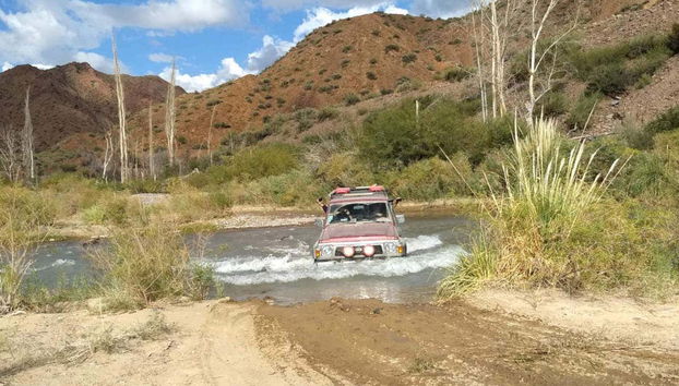 Wading in the jeep through the Castano river