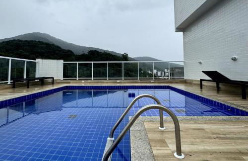 Apartamento novo a 350 m da praia das Toninhas em Ubatuba - 2 dormitórios sendo 1 suite, piscina, varanda gourmet com churrasqueira, ar condicionado, cozinha completa, garagem privativa - Foto 33