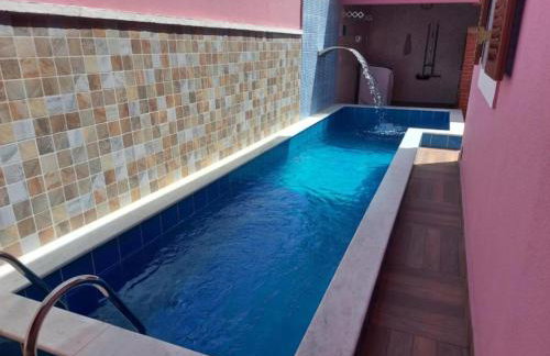 Casa Rosa de Peruíbe - Casa de Temporada 3 dormitórios, 10 hóspedes, piscina, wi-fi, netflix, 800 metros da praia - Photo 46
