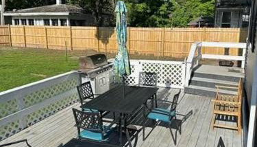 Spacious 4 BR 2BA Home with Bar and Fenced Yard - Photo 2