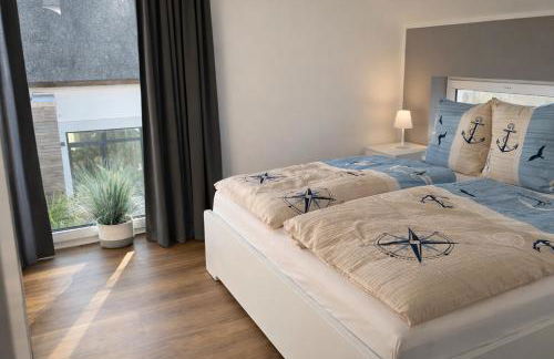 HausLIEBLINGSPLATZ - am Meer - Luxus Villa mit 4 Schlafzimmern, 3 Badezimmern Sauna, Kamin, Weber-Grill und Wallbox - Foto 10