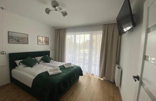 SOLEK, Apartamenty hotelowe i pokoje gościnne ze śniadaniem, przyjazne zwierzętom, wyjątkowe, z widokiem na Jezioro Jamno i w bardzo bliskiej odległości od morza - Foto 39