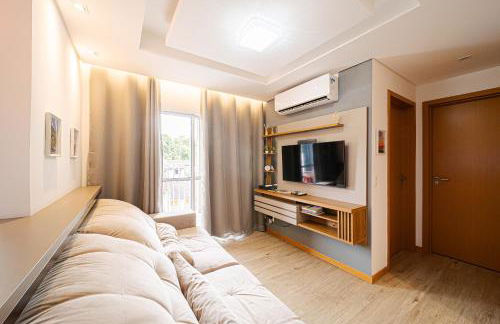 Aconchego e privacidade para sua família com 2 quartos, sala e cozinha integrados e sacada com churrasqueira - Foto 4