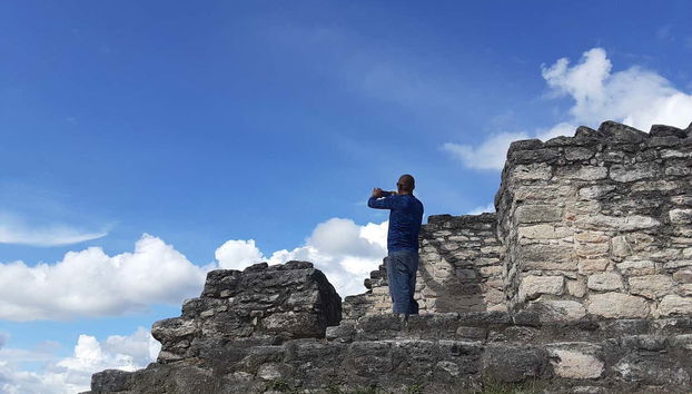 Take pictures of the ancient Mayan ruins